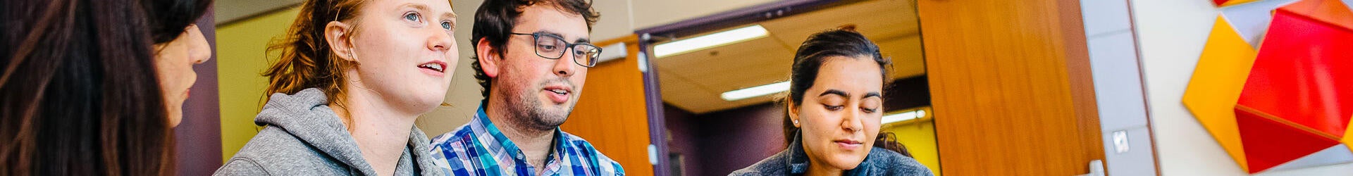 Students speaking with counselor