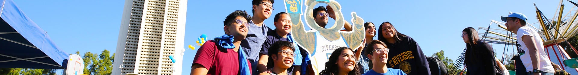 A group of students pose for a photo during an event on the UC Riverside campus.