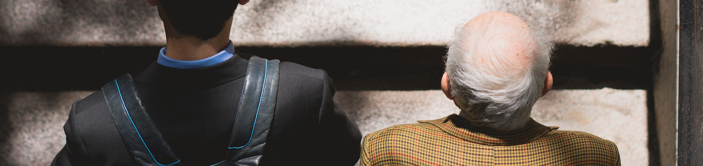 young man and older man climbing stairs