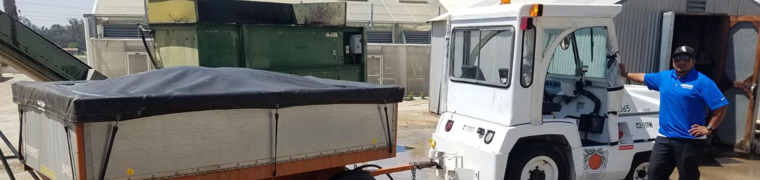 Soil tug and trailer with Ruben posing