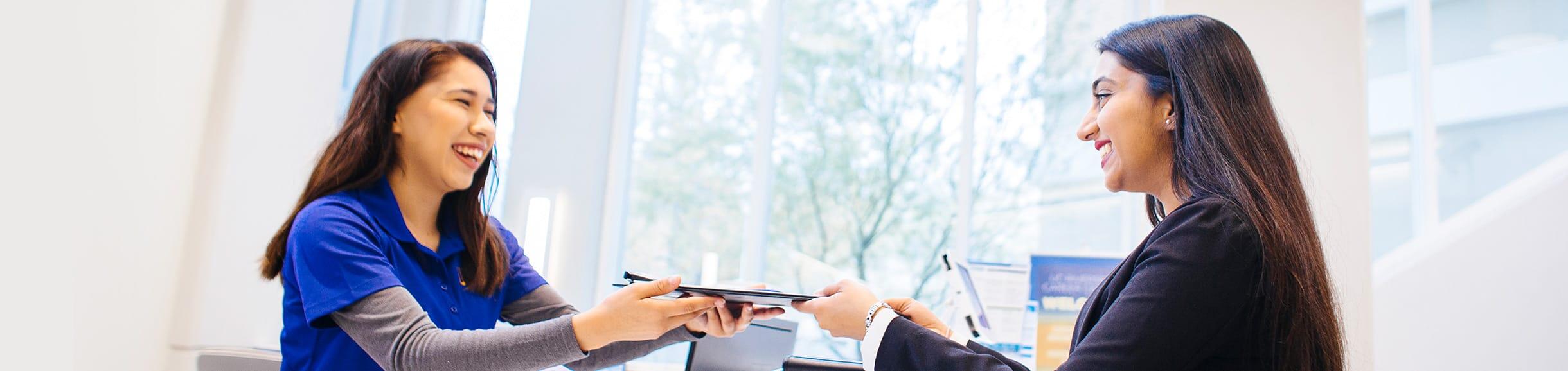 UCR staff helping an UCR alumni