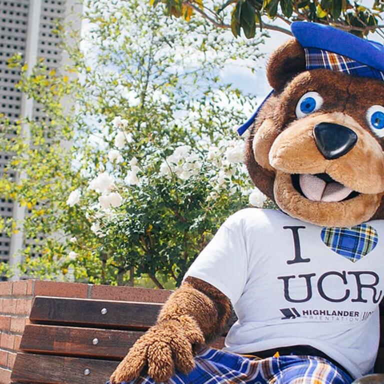 Scotty sitting with his statue