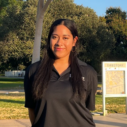 Fehi Lotoaniu smiling and wearing an APSP polo