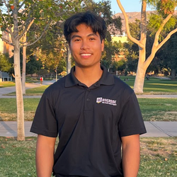 Jacob Pascasio smiling and wearing an APSP polo