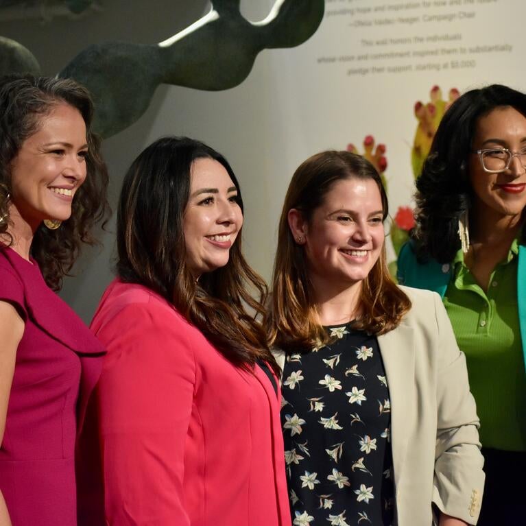Four women smiling for a picture