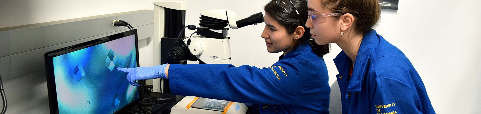 Jen and Fatima looking at computer monitor (c) UCR/CNAS