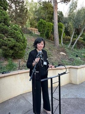 Host Ching Lui welcoming guests