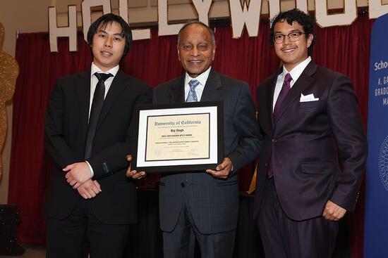 Raj Singh displays Golden Apple Award