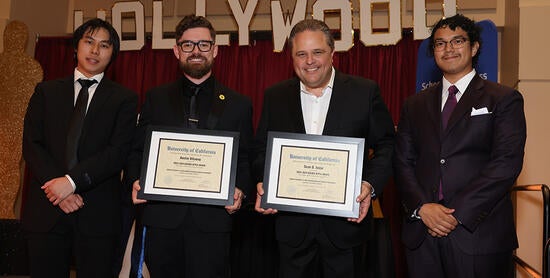 Sean Jasso and Austin Attaway displaying their awards
