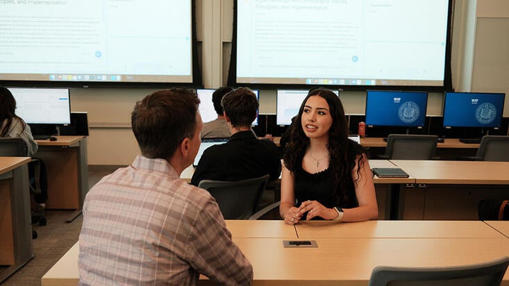 KTLA Reporter Rich DeMuro interviewing business administration student Jessica Covarrubias