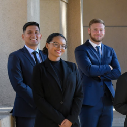 Graduate students outside of Anderson Hall