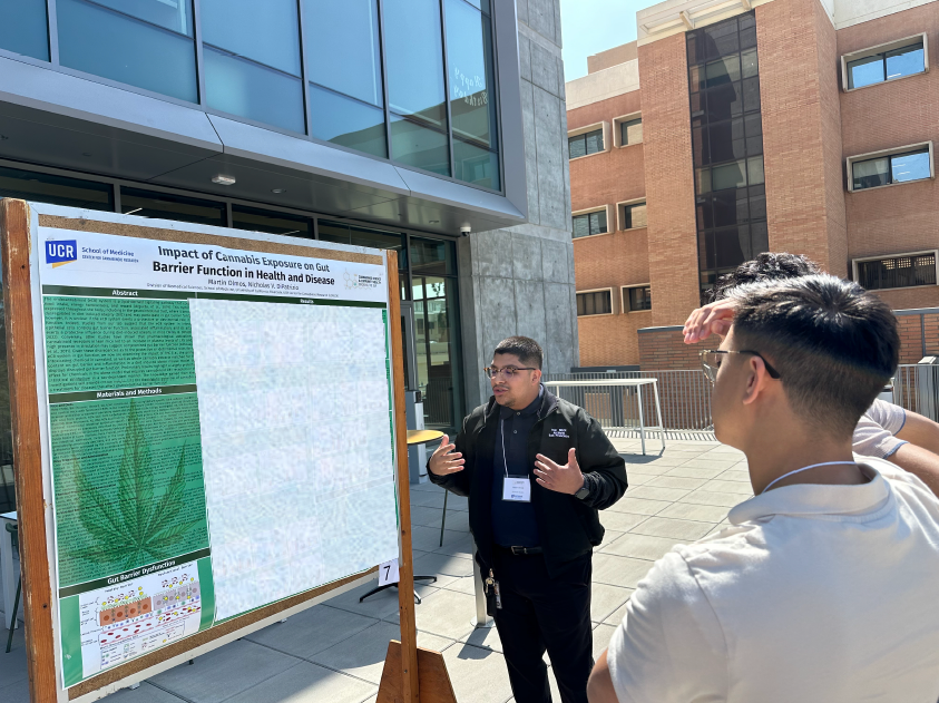 student presenting a poster