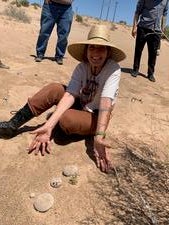 A CCB student posing with desert plants 