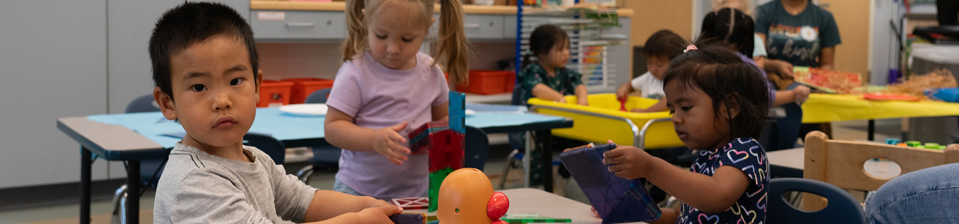 children doing various activities at table