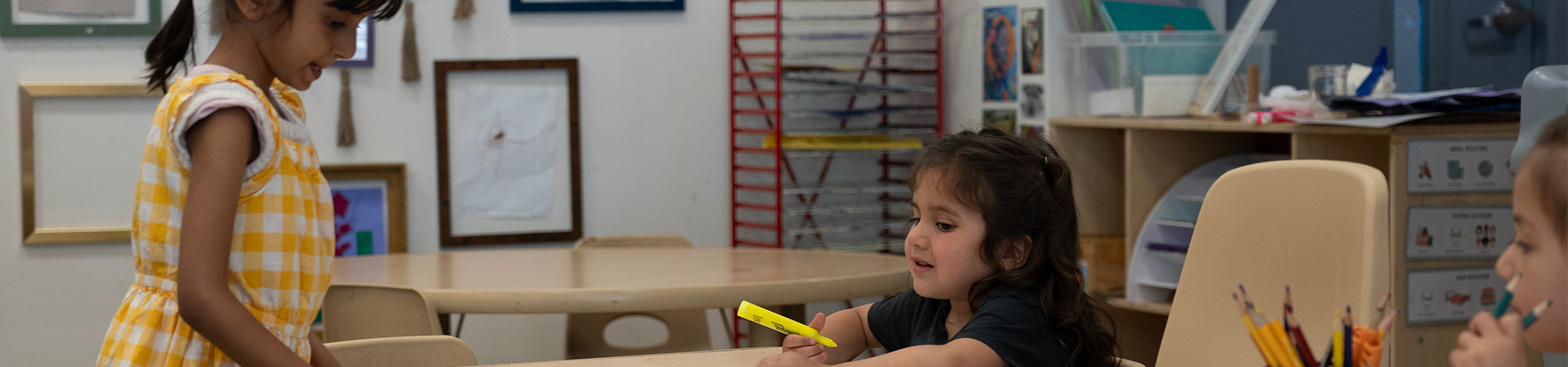 children drawing at table