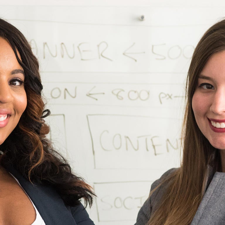 women smiling at camera
