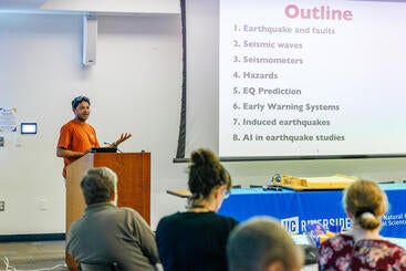 Abhijit Ghosh speaking at the RUSD Earth and Planetary Sciences Symposium.