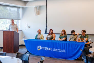 Gareth Funning speaking at the RUSD Earth and Planetary Sciences Symposium.