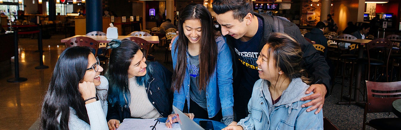 Students in HUB, laughing, (c) UCR