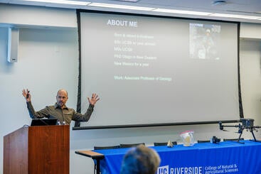 Nicolas Barth speaking at the RUSD Earth and Planetary Sciences Symposium.