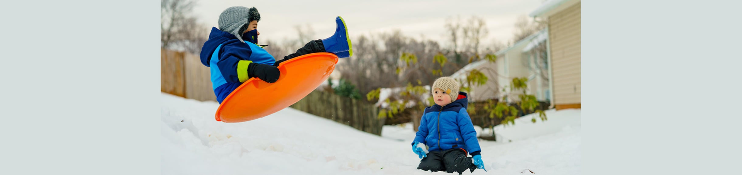 kids sledding (c) unsplash