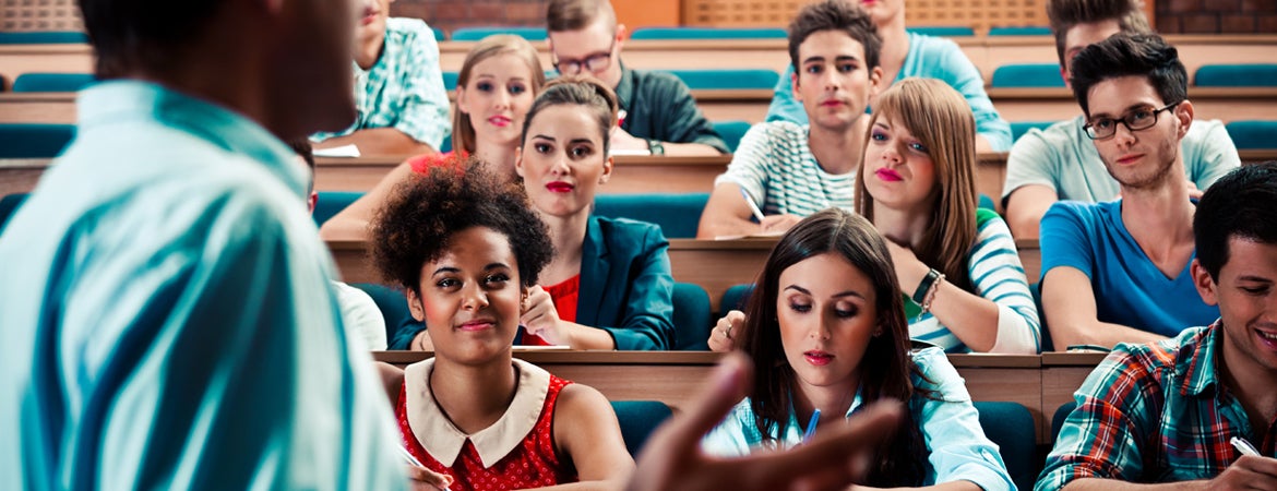 Students listen and take notes during a lecture. 