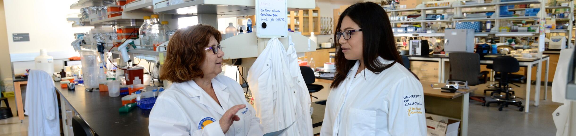 Dr. Coss speaking to graduate student