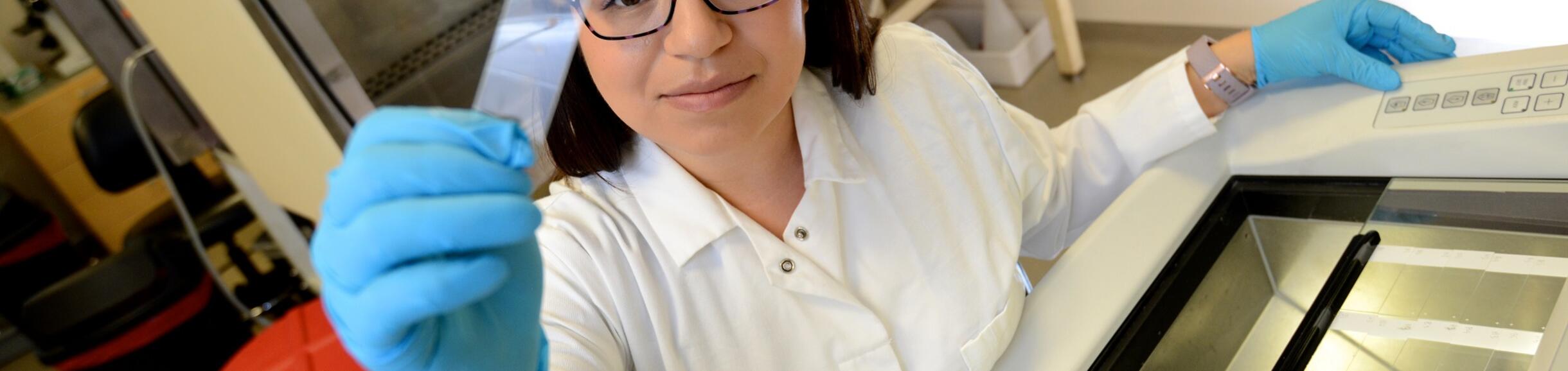 Nancy Lainez looking at slide