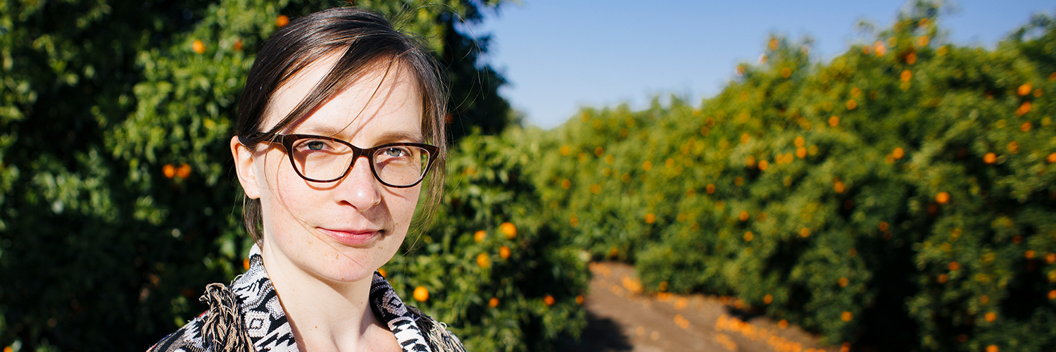woman in orange grove