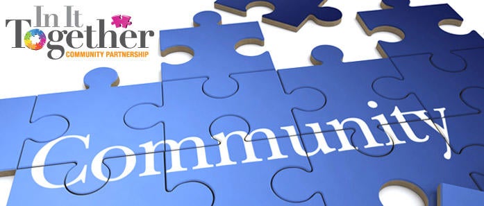 The In It Together logo is paired with a puzzle pieces assembled to form the word "Community."
