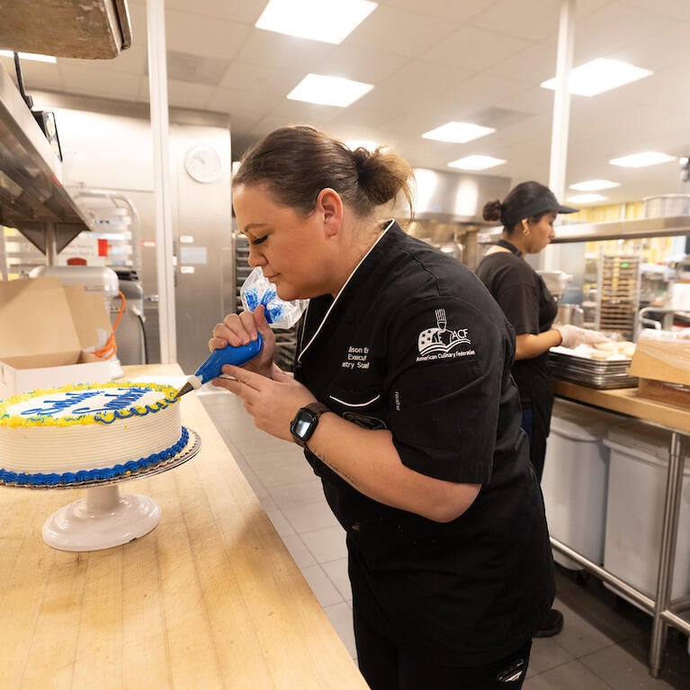 Bakers decorate cakes
