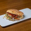 A Beef Kota Pita Wrap on a white plate.