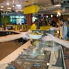 A student receives food from a worker at the Halal Shack at the HUB.