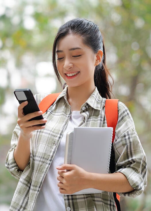 student ordering food on her phone