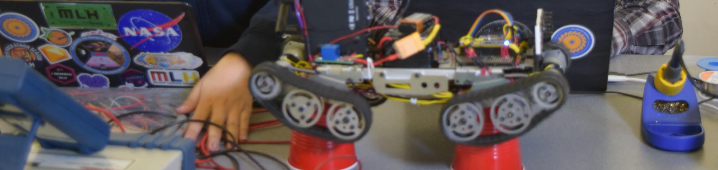 students with robot and computer