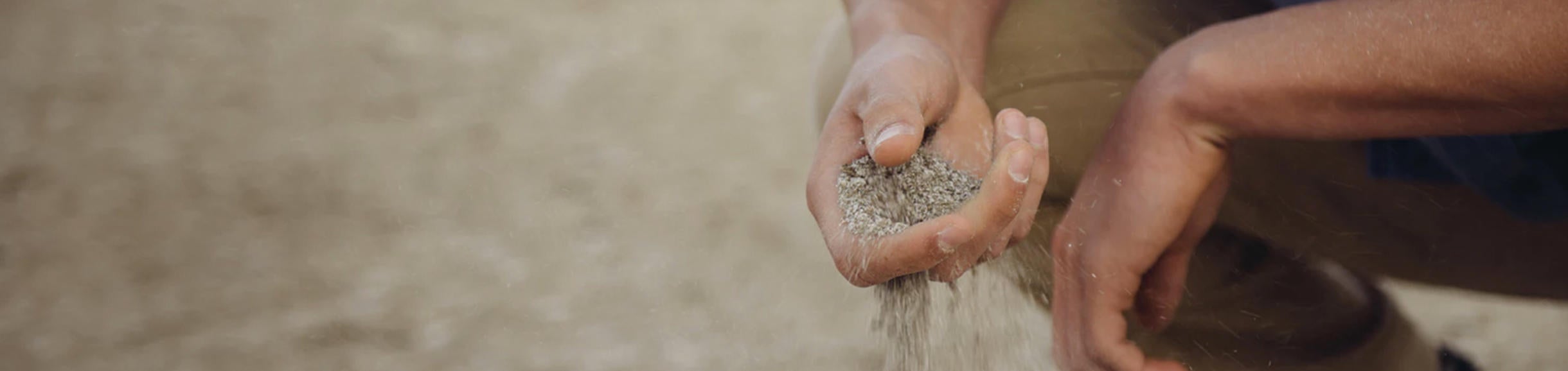 Sand going through hand