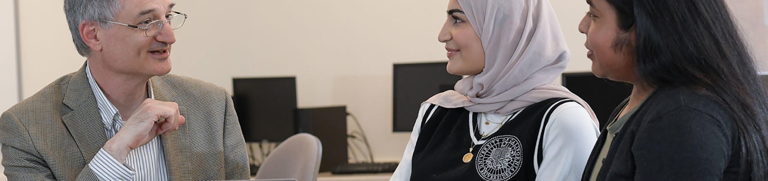 Education Policy and Analysis & Leadership Instructor with students