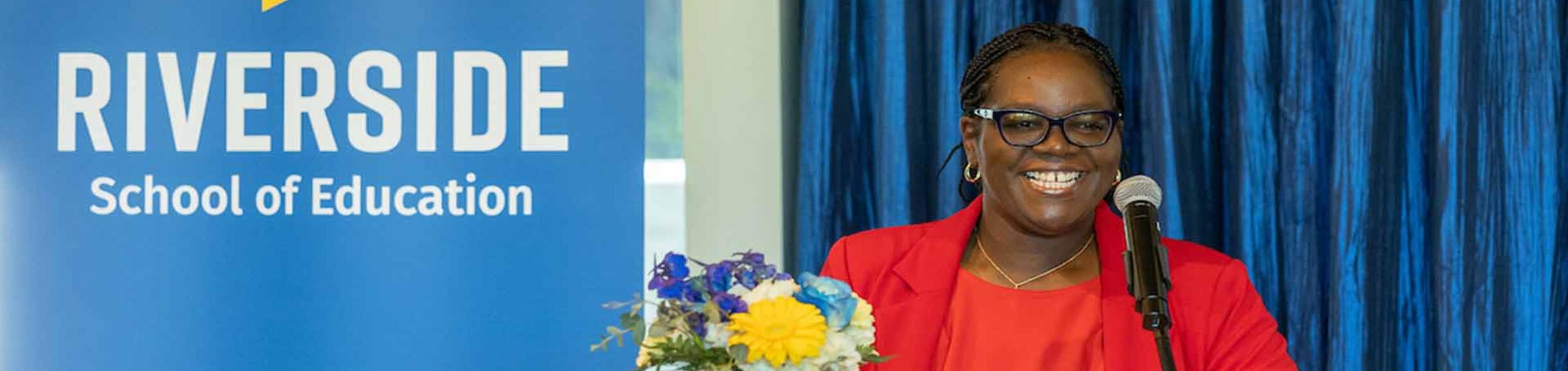 Dean Spencer at a podium