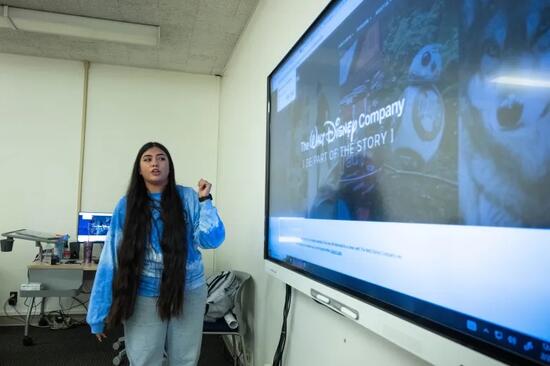 Jennifer Ibarra next to screen