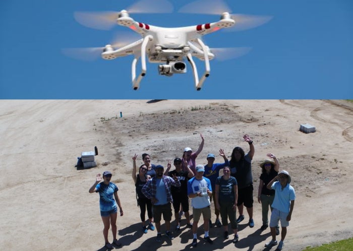 Undergrads waving hi to drone.