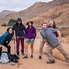 group photo of students and faculty in front of red mountains