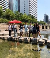 Group of students standing on blocks in the seoul river