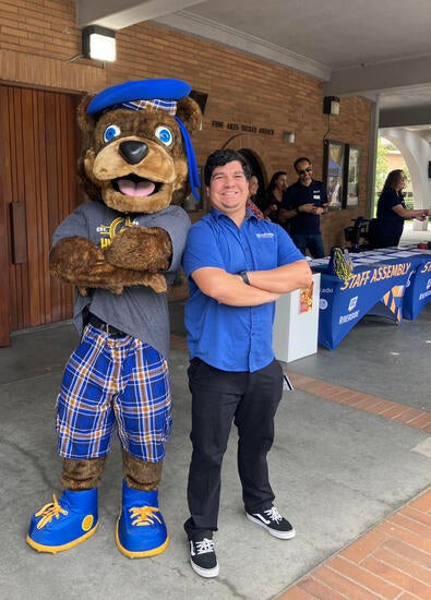 Scotty the bear poses with Hondo at an event