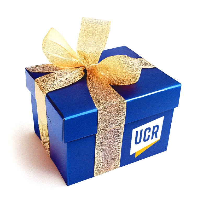 A Blue gift box with gold ribbon and the UCR monogram. A Blue gift box with gold ribbon and the UCR monogram.