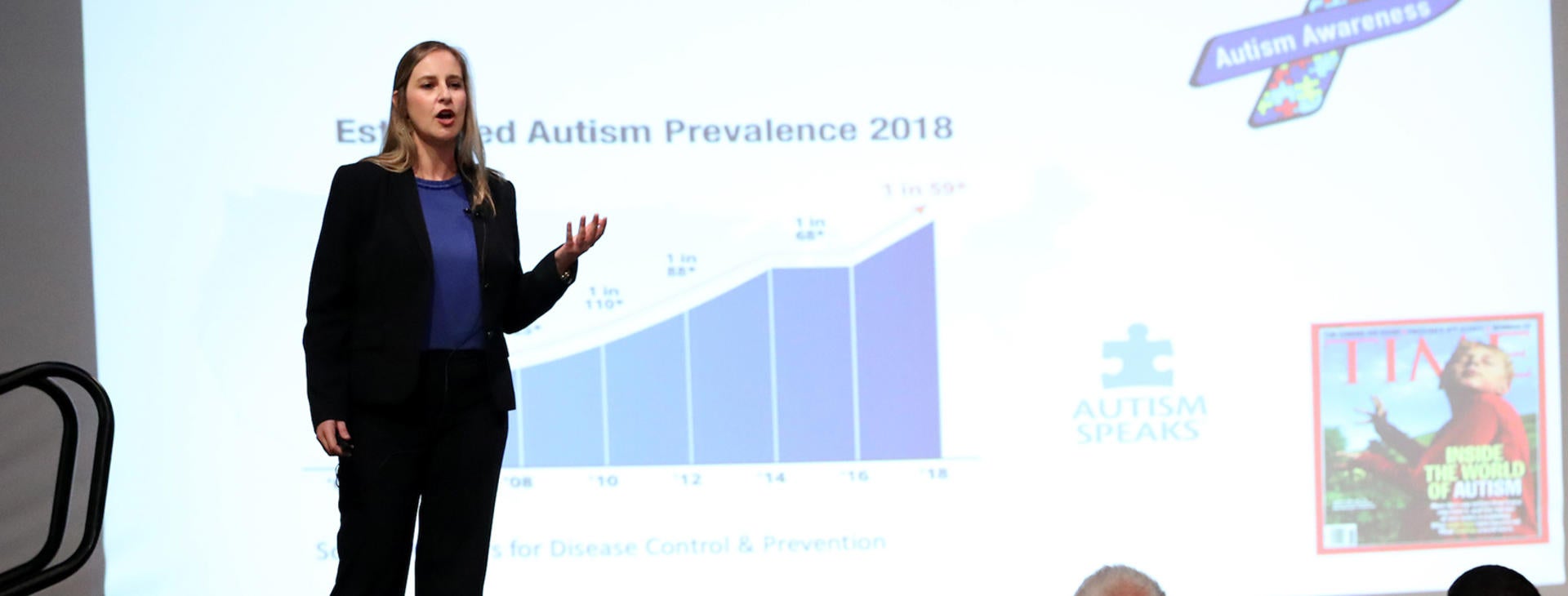 student giving presentation on stage at GradSlam 2019 (c) UCR/Stan Lim