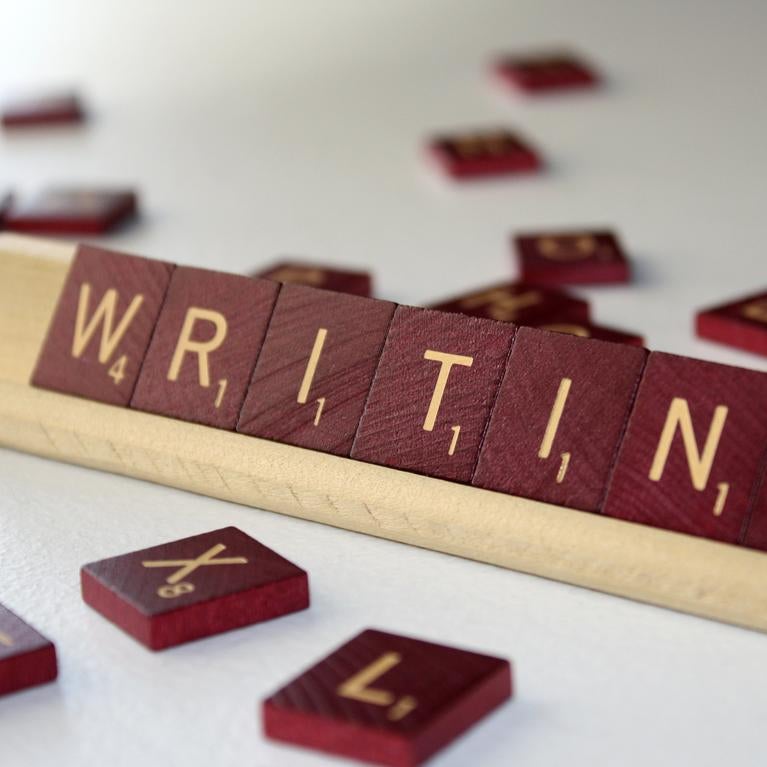 Scrable tiles spelling: writing 