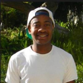 Patrick Thomas smiling at the viewer