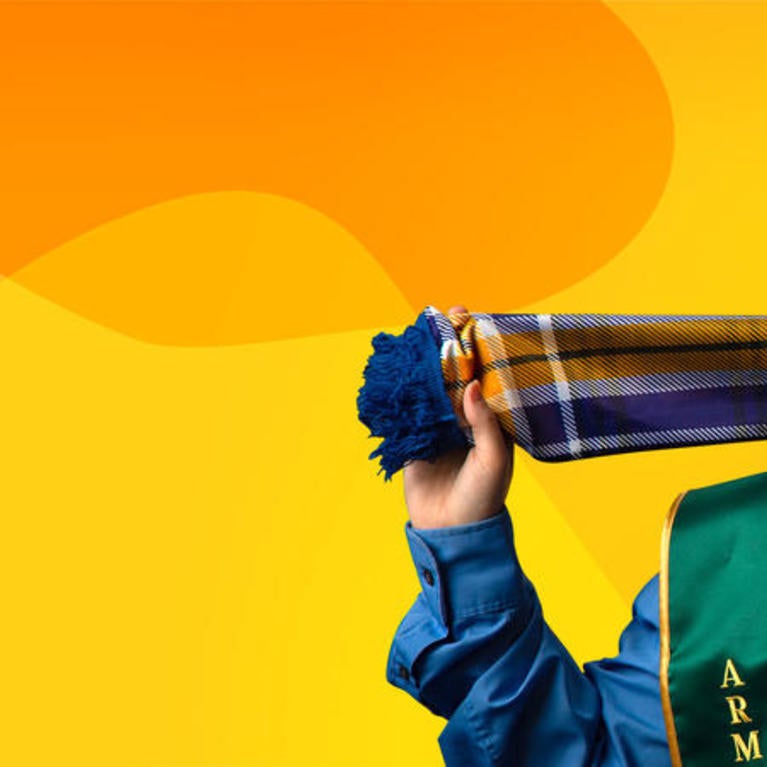 Header Photo of Student in Regalia