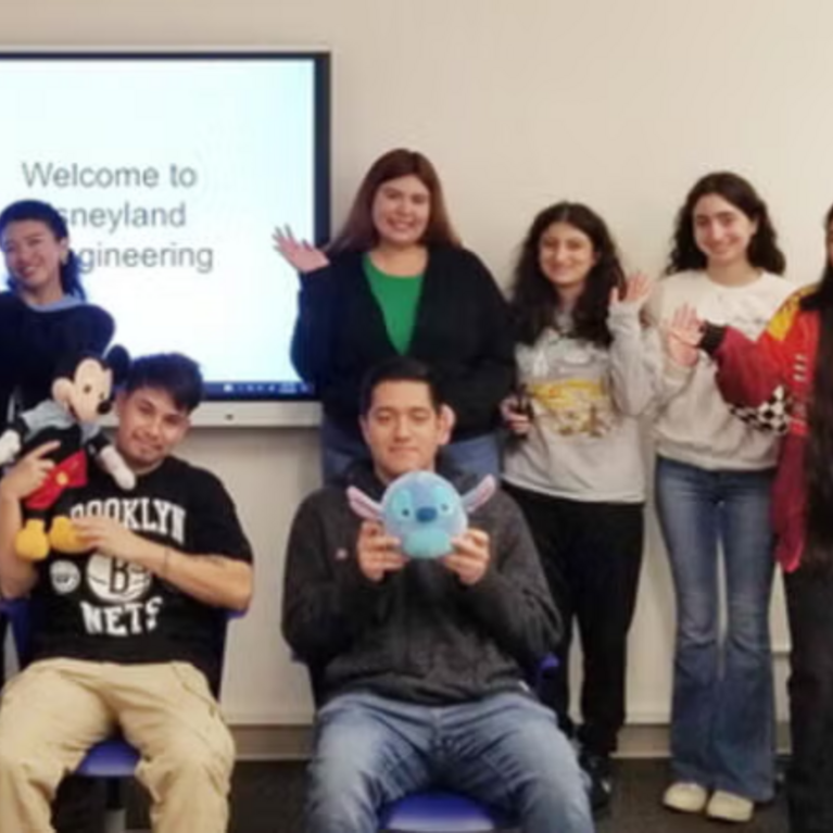 Students posing for photo in front of their R'Course, EDUC198