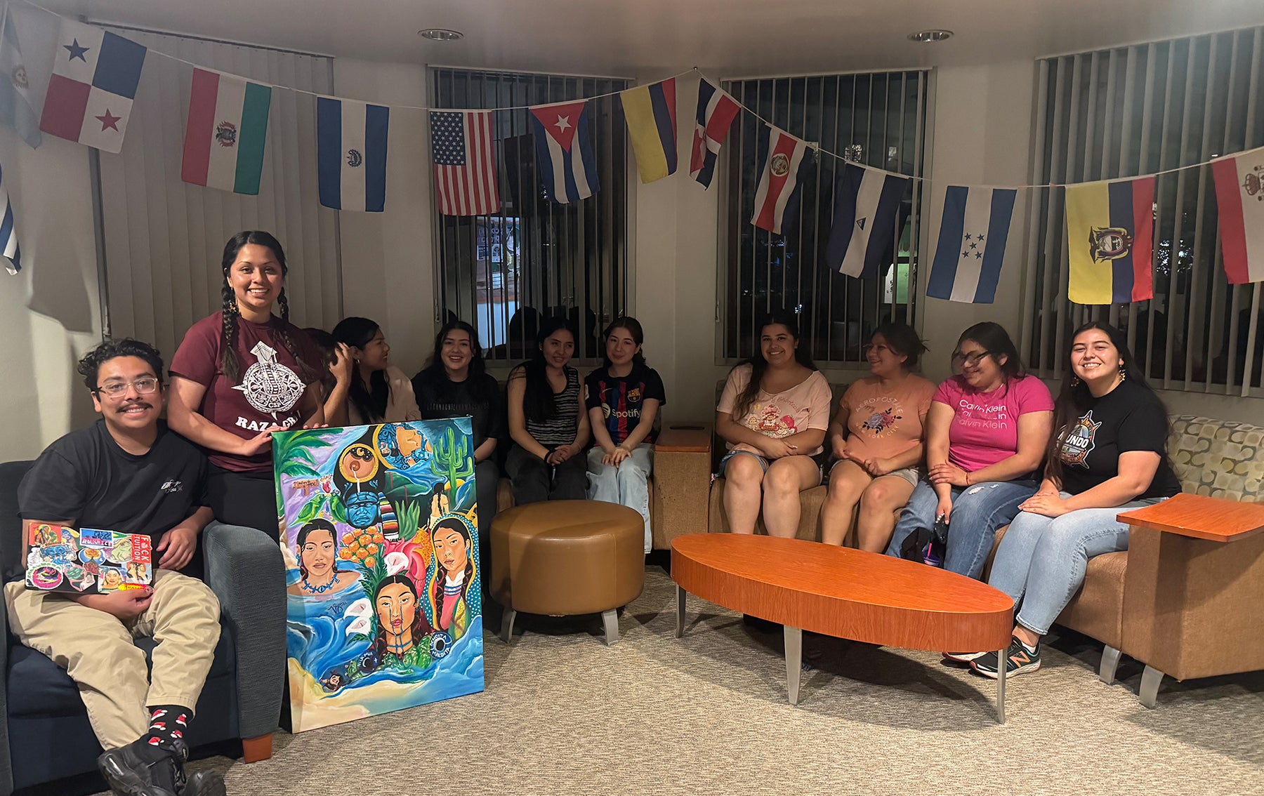 students in living room with flags of latin america
